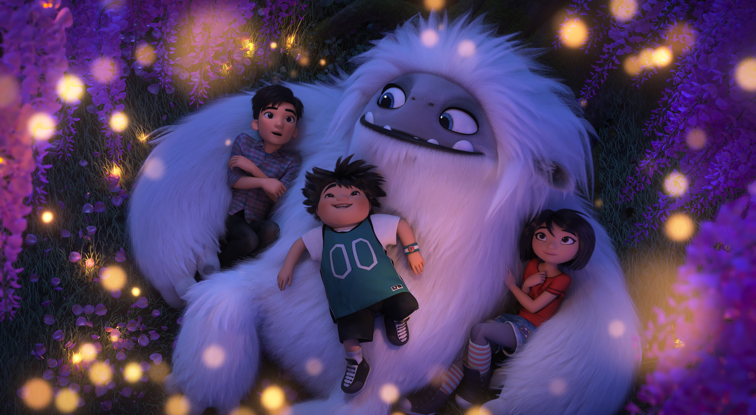 From left, Jin (Tenzing Norgay Trainor), Peng (Albert Tsai) and Yi (Chloe Bennet) enjoy a peaceful moment beneath a flowering tree with Everest the Yeti in DreamWorks Animation and Pearl Studio’s "Abominable," written and directed by Jill Culton.