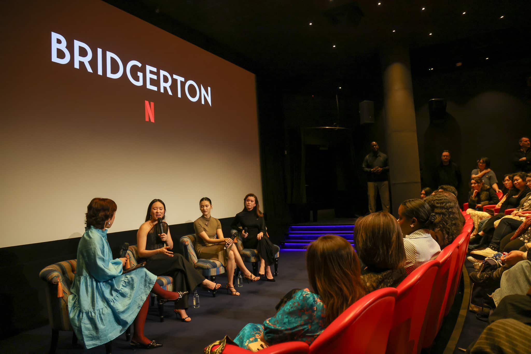 Bridgerton Season 4 cast members Yerin Ha, Katie Leung, and Isabella Wei speaking at a MilkTea Films ESEA community screening in London.