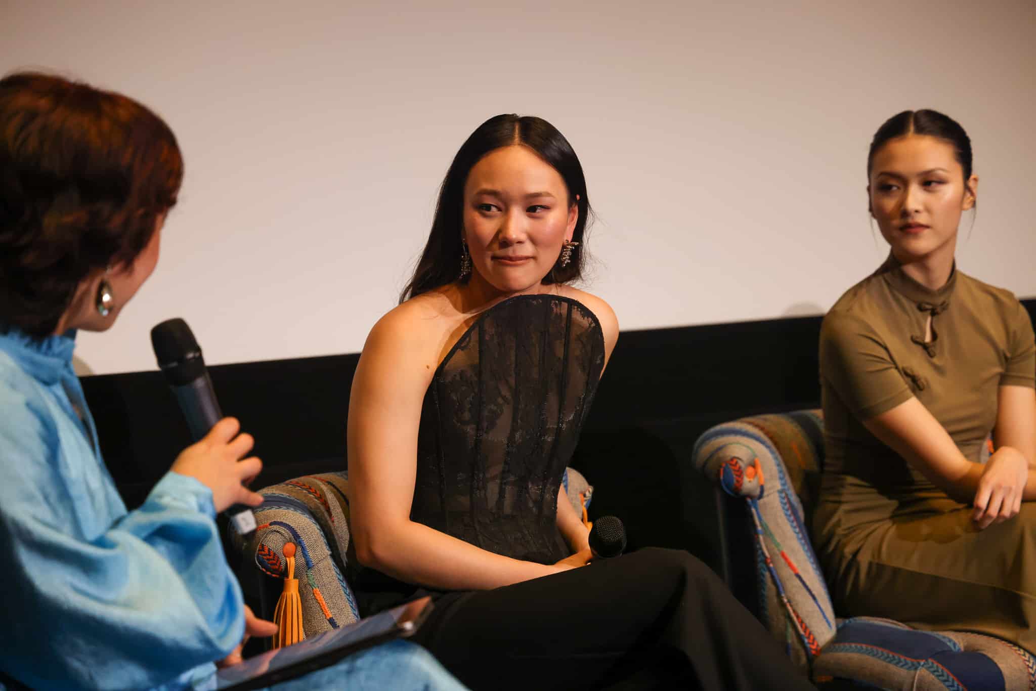 Bridgerton Season 4 cast members Yerin Ha, Katie Leung, and Isabella Wei speaking at a MilkTea Films ESEA community screening in London.